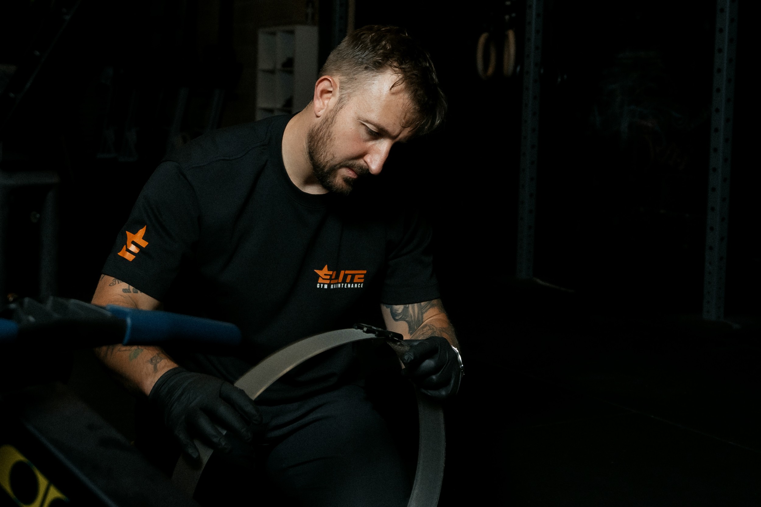 Elite Gym Maintenance cleaning a perf assembly.