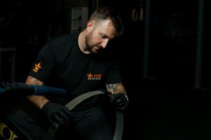 Elite Gym Maintenance cleaning a perf assembly.